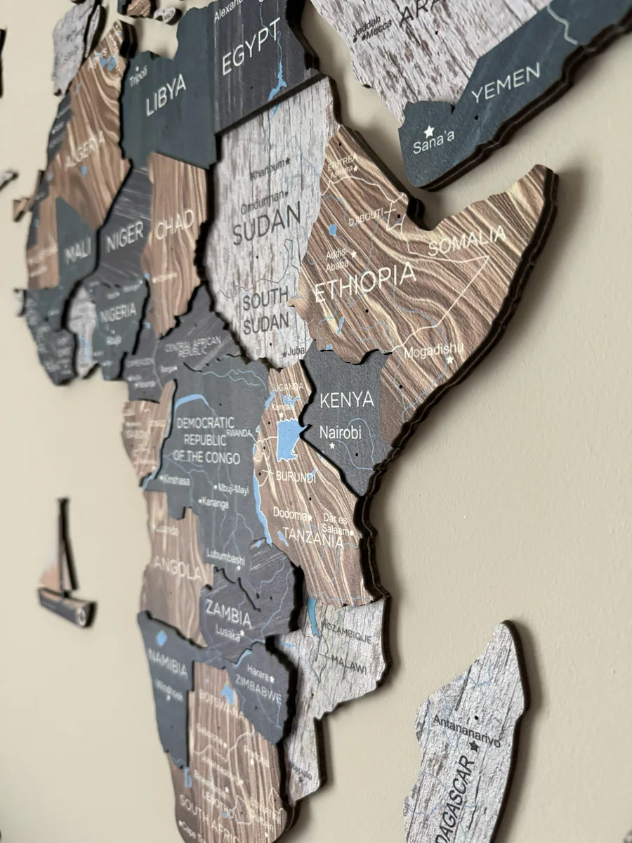Close-up photo of Enjoy The Wood wood layers and printed map detail