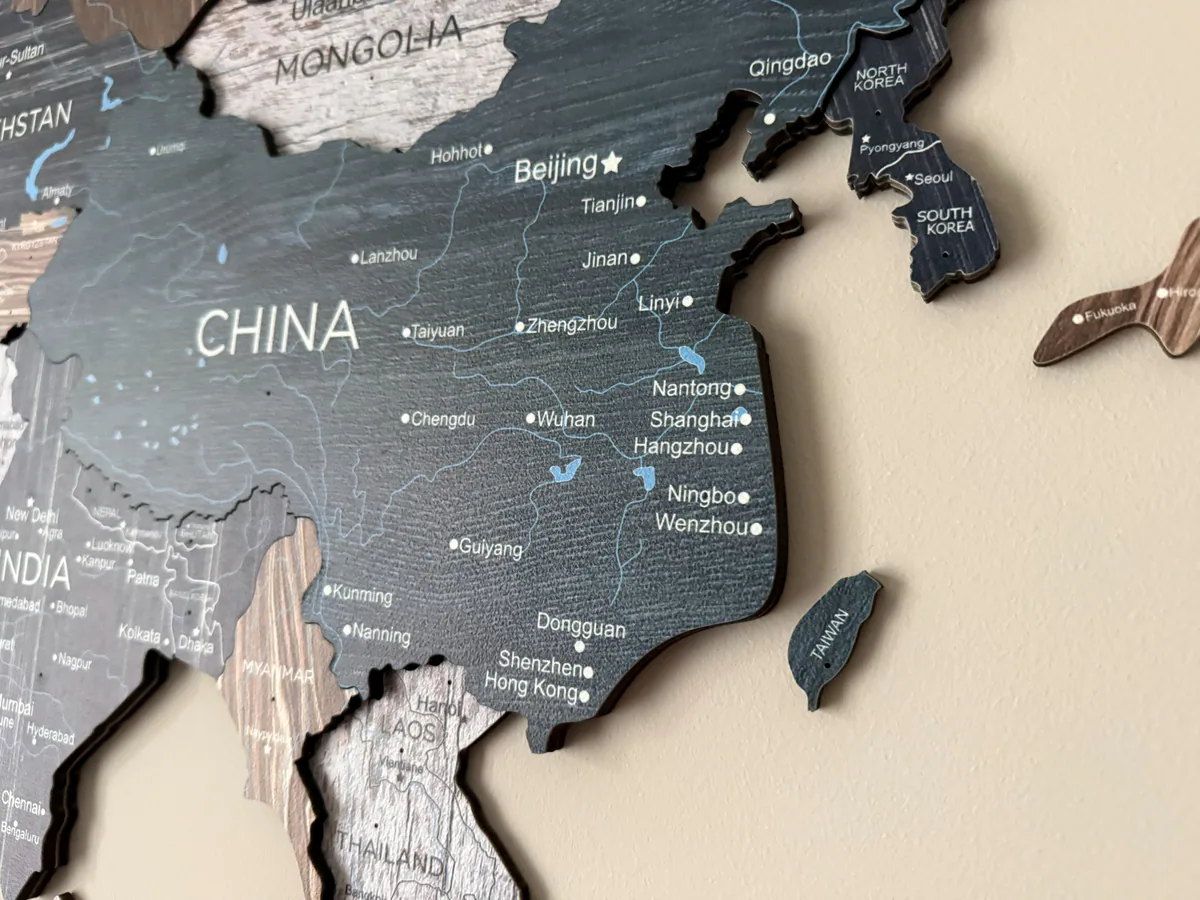 Close-up photo of Enjoy The Wood map wood grain and printed details