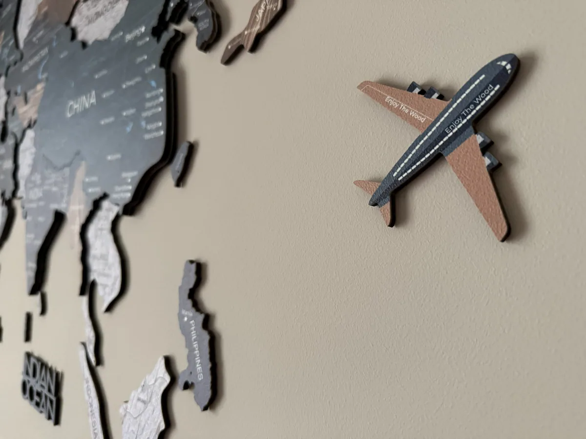 Angled photo showing the 3D depth of an Enjoy The Wood map on the wall